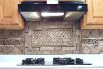 Natural Stone Backsplash with Pencil Liner and Herringbone