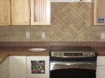 Brick-lay Backsplash with Herringbone insert
